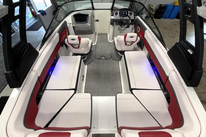 Slide: The Image of 2019 Chaparral Vortex 2430 VRX Wake Series boat interior with red and white seating. - 24