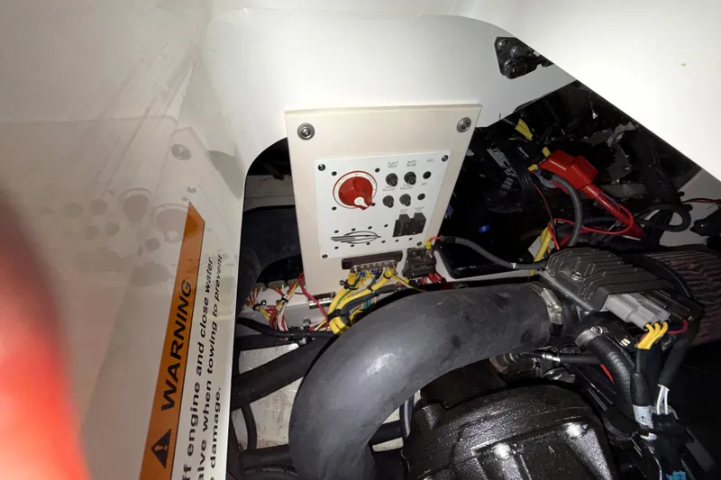 Slide: The Image of Engine compartment of 2019 Chaparral Vortex 2430 VRX Wake Series boat, showing wiring and control panel. - 27