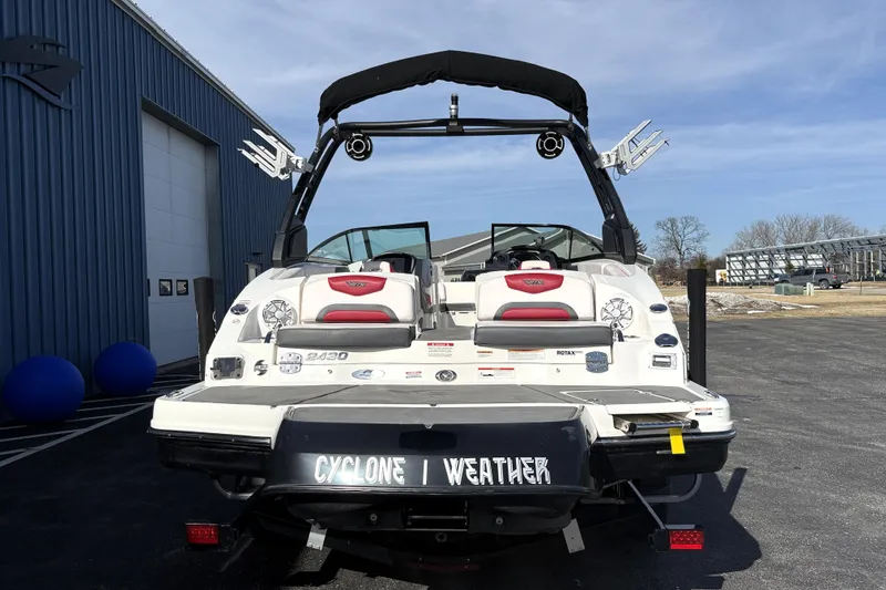 Slide: The Image of 2019 Chaparral Vortex 2430 VRX Wake Series boat, rear view, parked outdoors. - 5