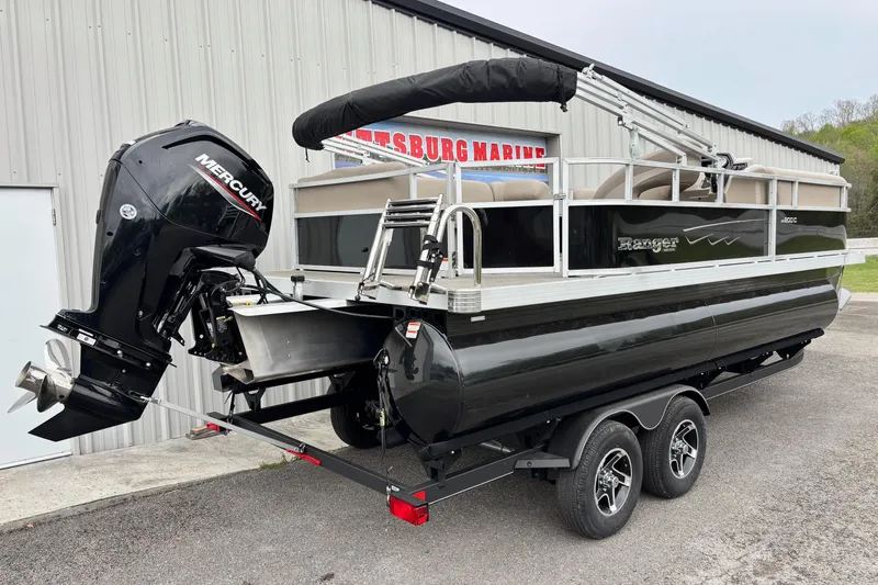 Slide: The Image of 2025 Ranger 200C pontoon boat with Mercury outboard motor on a trailer. - 10