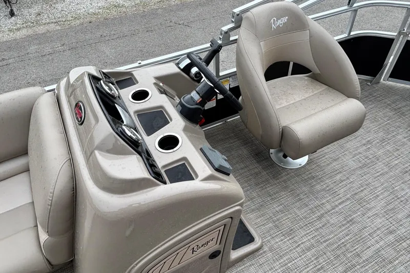 Slide: The Image of Interior of 2025 Ranger 200C boat with steering console and captain's chair. - 6