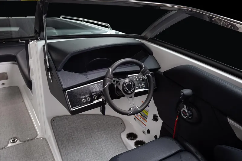 Slide: The Image of Manufacturer Provided Image: 2025 Four Winns HD5 boat interior with sleek dashboard and steering wheel. - 7