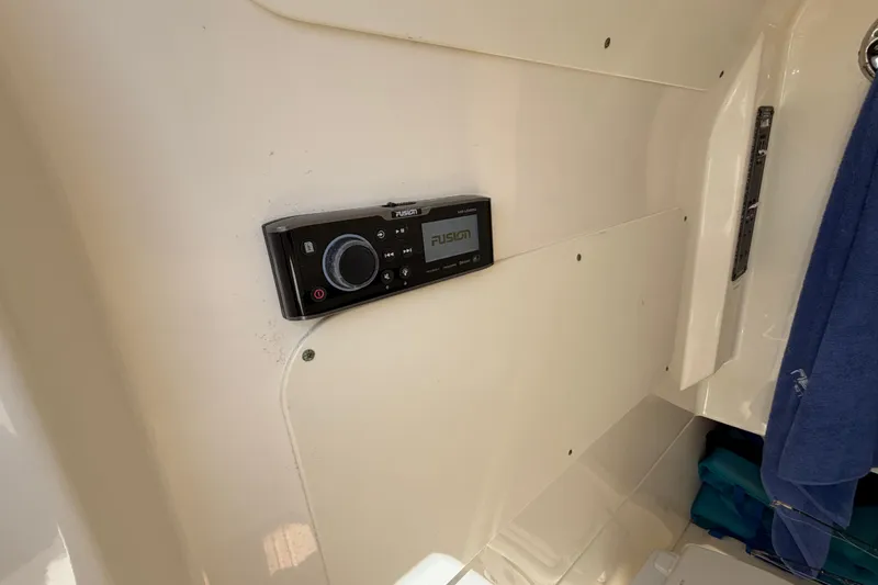 Slide: The Image of Fusion stereo system on 2019 Boston Whaler 330 Outrage boat interior. - 36