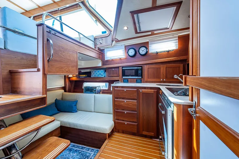 Slide: The Image of Luxurious interior of 2015 Sabre 38 Salon Express yacht with wood finishes and modern amenities. - 11