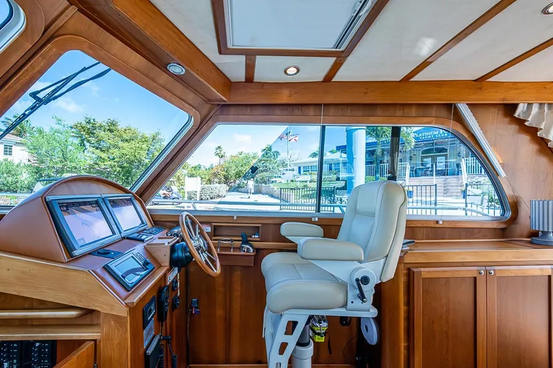 Slide: The Image of 2015 Sabre 38 Salon Express helm with luxurious seating and advanced navigation systems. - 6