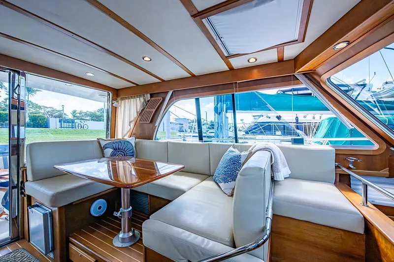 Slide: The Image of Luxurious interior of 2015 Sabre 38 Salon Express yacht with elegant seating and wooden accents. - 9