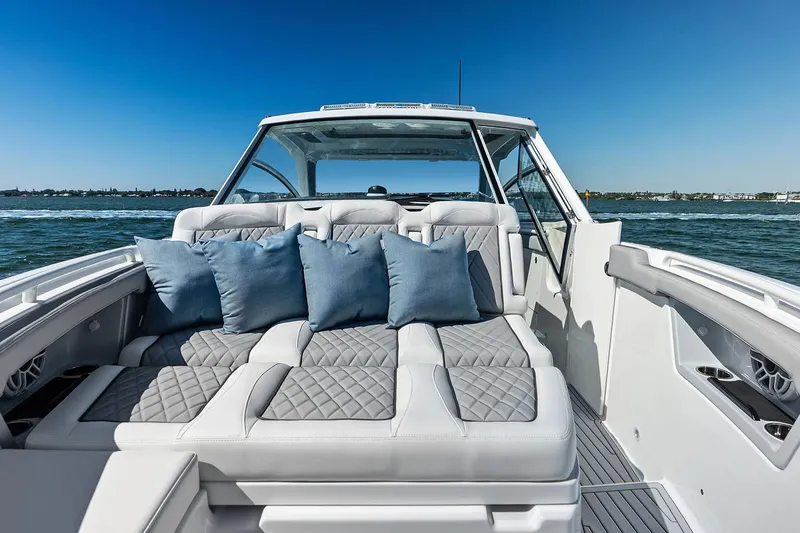 Slide: The Image of Manufacturer Provided Image: Luxurious 2025 Everglades 367 CX boat interior with plush seating and ocean view. - 4