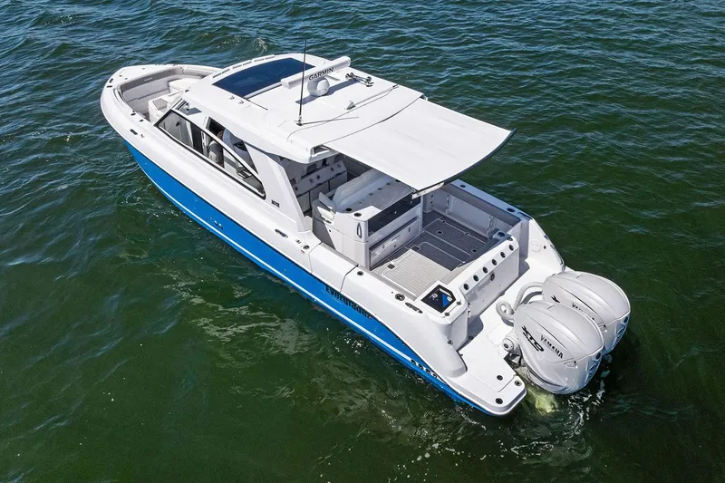 Slide: The Image of Manufacturer Provided Image: 2025 Everglades 367 CX boat with dual Yamaha engines on open water. - 6