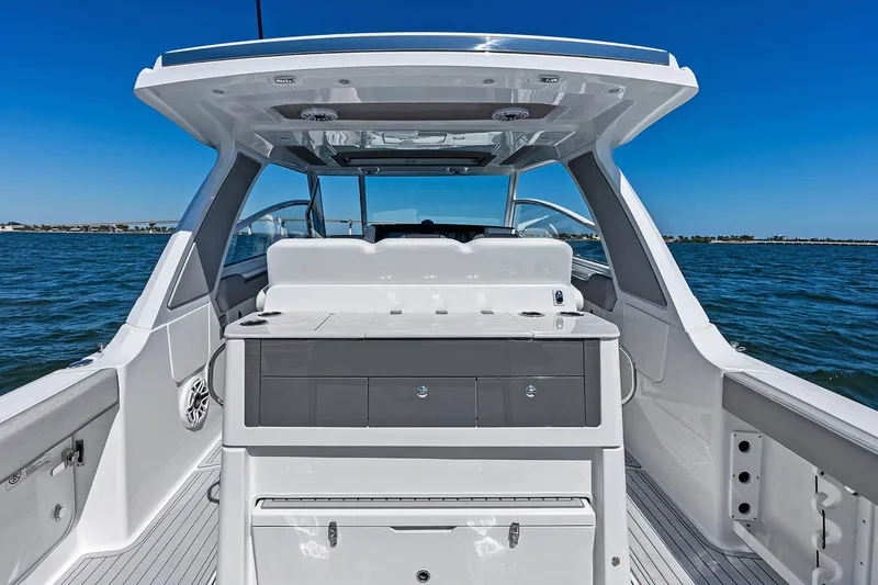 Slide: The Image of Manufacturer Provided Image: 2025 Everglades 367 CX boat interior with sleek design on open water. - 8