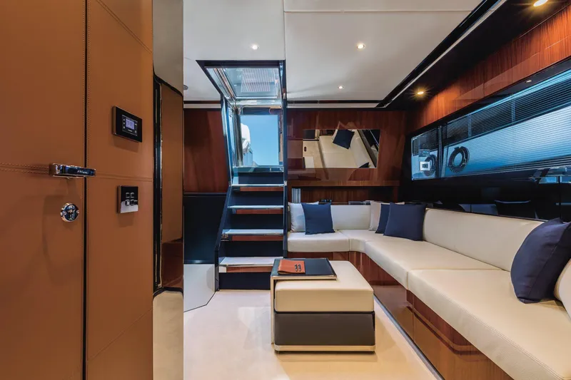 Slide: The Image of Luxurious interior of 2021 Riva Dolceriva 48 yacht with modern seating and elegant design. - 14