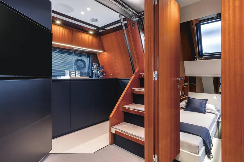 Slide: The Image of Interior of 2021 Riva Dolceriva 48 yacht with modern wood and black finishes. - 16