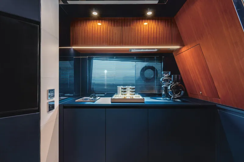 Slide: The Image of Modern kitchen interior of 2021 Riva Dolceriva 48 yacht with sleek cabinetry and ambient lighting. - 19