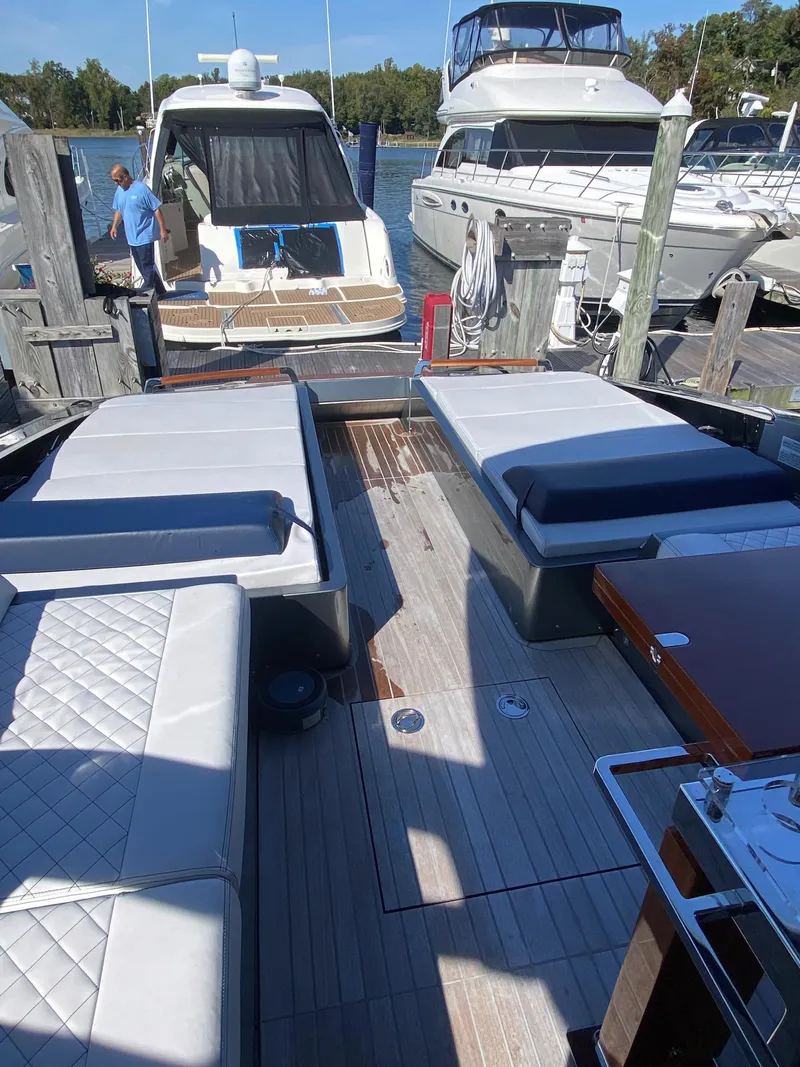 Slide: The Image of 2021 Riva Dolceriva 48 luxury yacht docked with spacious seating area. - 7