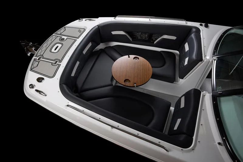 Slide: The Image of Manufacturer Provided Image: 2025 Four Winns HD8 boat interior with sleek seating and a central wooden table. - 5