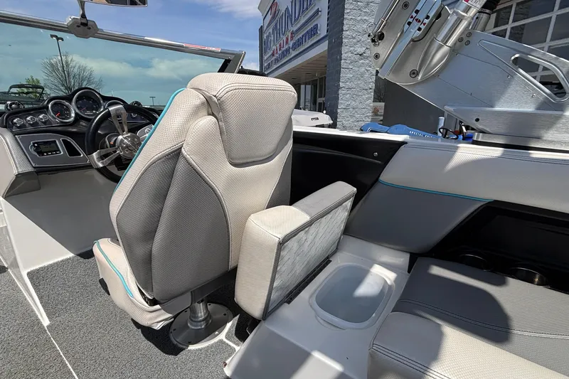 Slide: The Image of Interior of a 2017 MasterCraft XT23 boat, featuring sleek seating and modern controls. - 19
