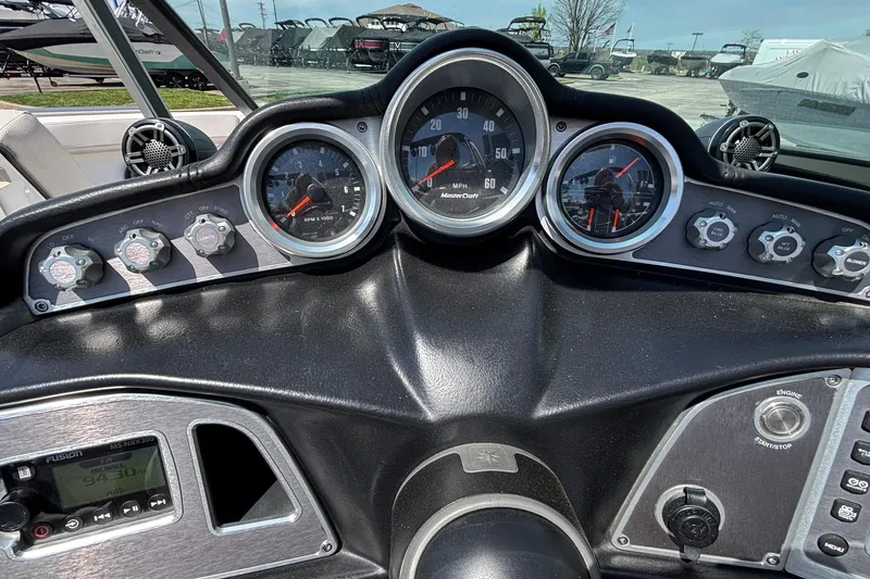 Slide: The Image of Dashboard of a 2017 MasterCraft XT23 boat with gauges and controls. - 37