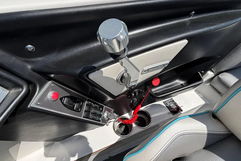 Slide: The Image of Interior controls of a 2017 MasterCraft XT23 boat, featuring throttle and switches. - 39