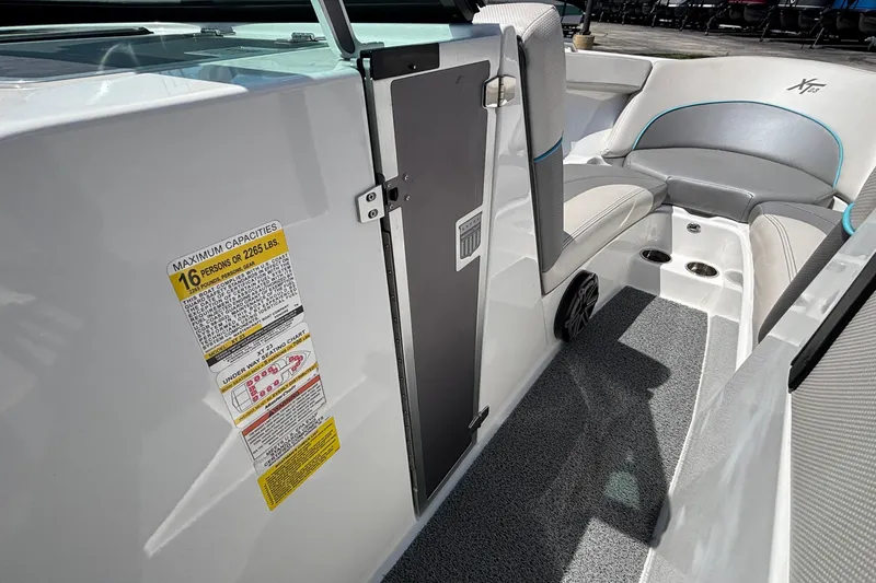 Slide: The Image of 2017 MasterCraft XT23 interior with seating, capacity label, and speaker detail. - 43