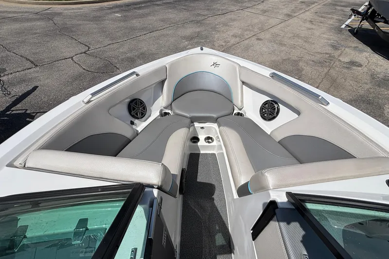 Slide: The Image of 2017 MasterCraft XT23 boat interior with gray seating and speakers. - 44