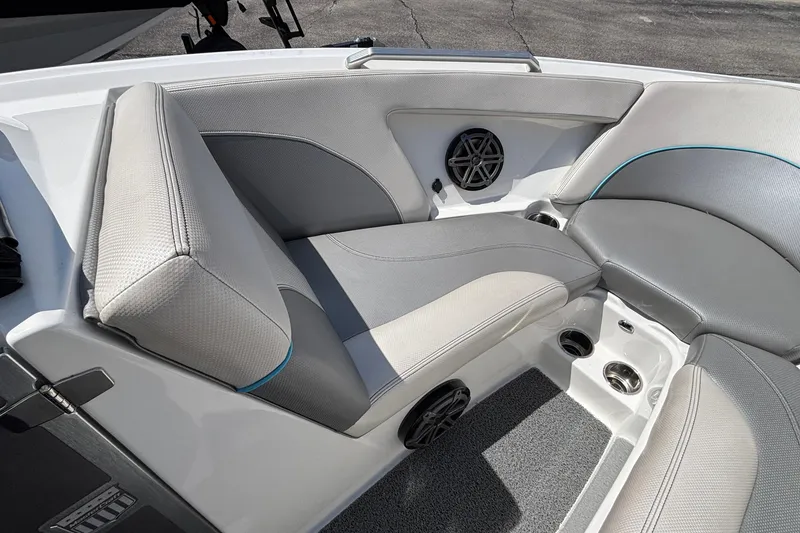 Slide: The Image of 2017 MasterCraft XT23 boat interior with gray seating and speaker system. - 45