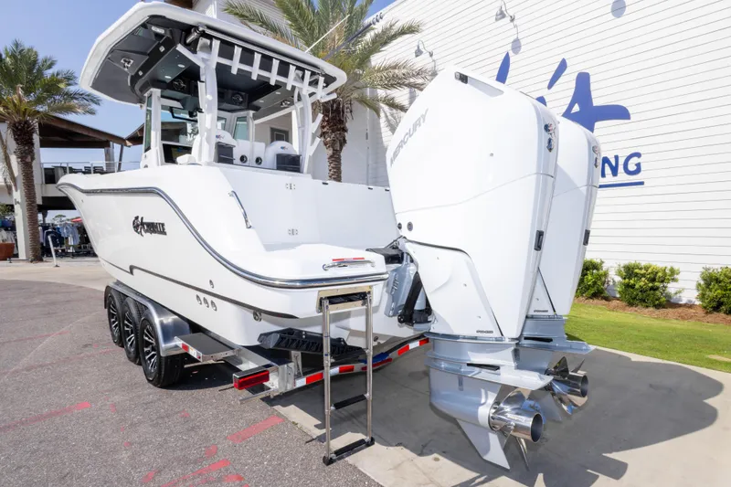 Slide: The Image of 2026 Crevalle 33 CSF boat with dual Mercury engines on a trailer. - 15