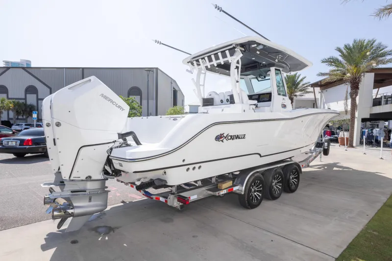 Slide: The Image of 2026 Crevalle 33 CSF boat on trailer, featuring Mercury outboard engines. - 16