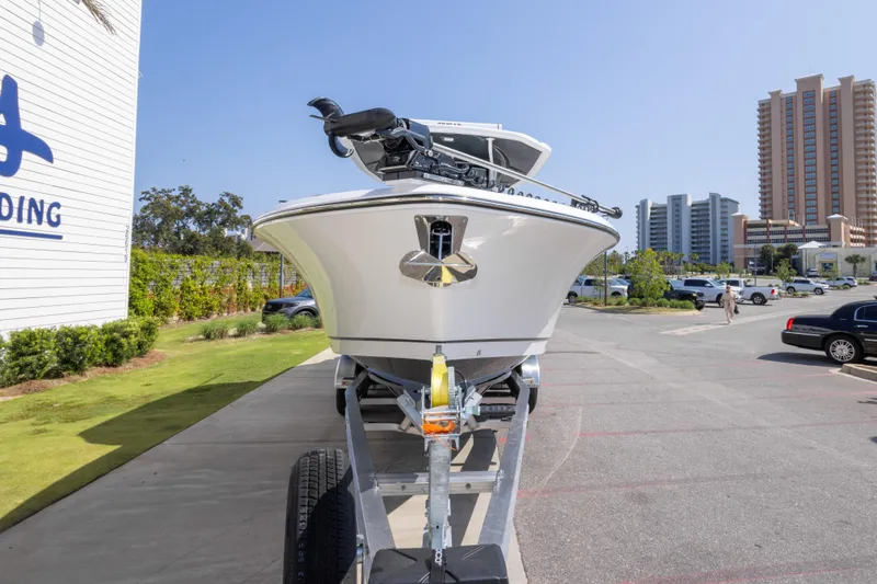 Slide: The Image of 2026 Crevalle 33 CSF boat on trailer, urban background, sunny day. - 21