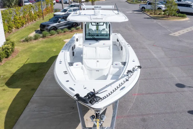 Slide: The Image of 2026 Crevalle 33 CSF boat on display in a parking area. - 23