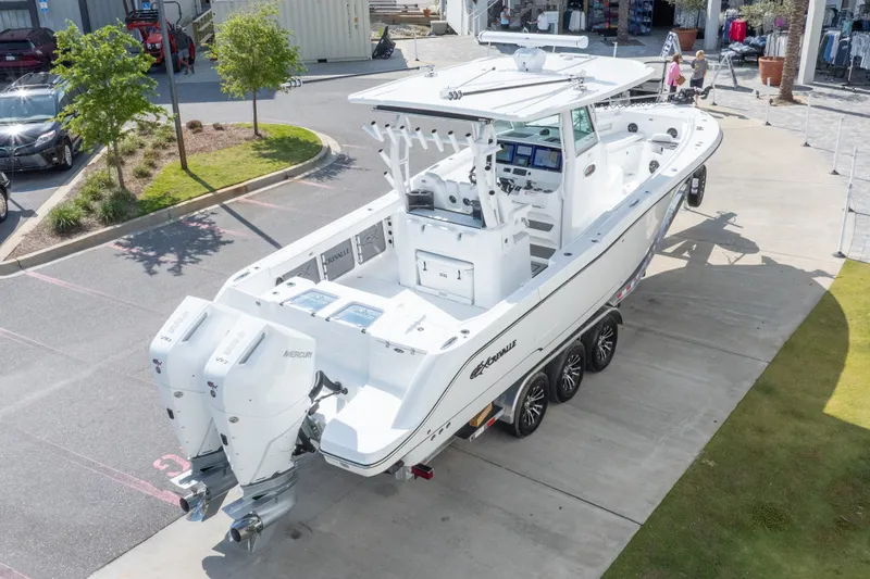 Slide: The Image of 2026 Crevalle 33 CSF boat with dual Mercury engines on a trailer. - 24