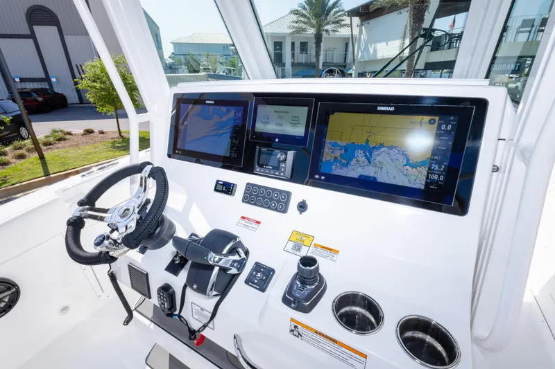 Slide: The Image of 2026 Crevalle 33 CSF boat dashboard with advanced navigation displays and controls. - 27