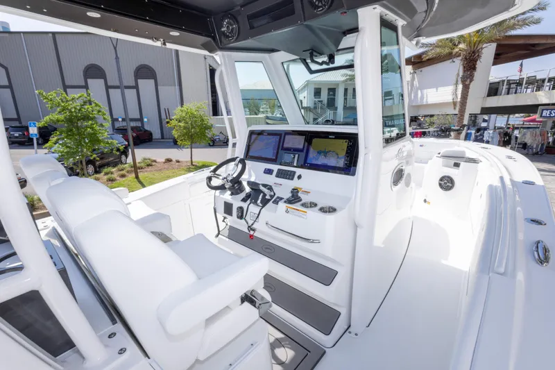 Slide: The Image of 2026 Crevalle 33 CSF boat cockpit with modern navigation equipment and seating. - 29