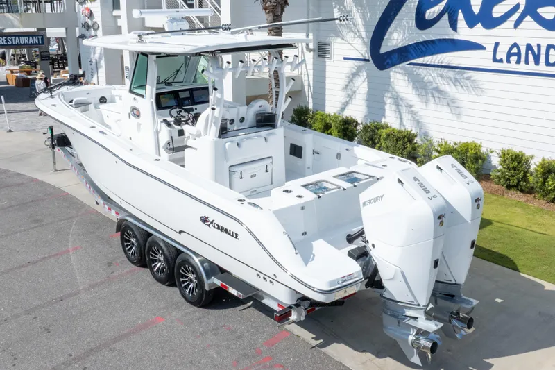 Slide: The Image of 2026 Crevalle 33 CSF boat with dual Mercury engines on a trailer. - 3