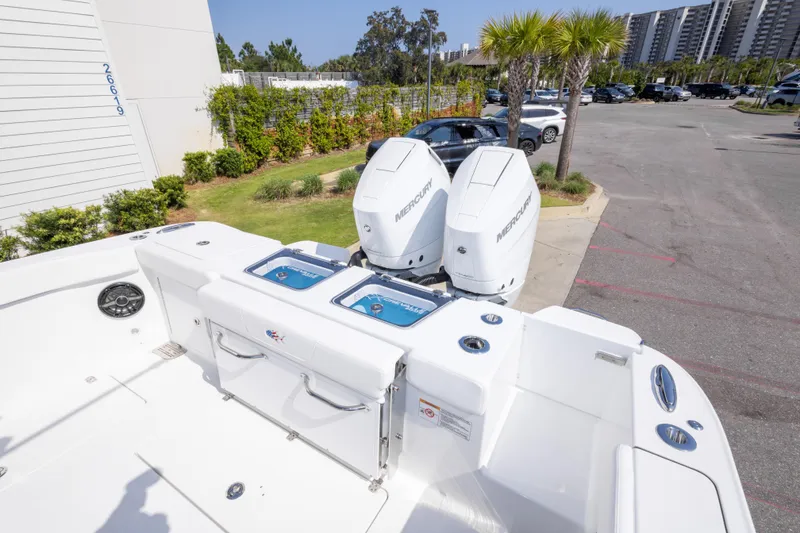 Slide: The Image of 2026 Crevalle 33 CSF boat with dual Mercury engines in a parking area. - 33