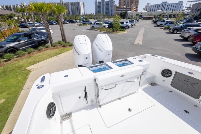 Slide: The Image of 2026 Crevalle 33 CSF boat with dual Mercury engines in a parking lot. - 34