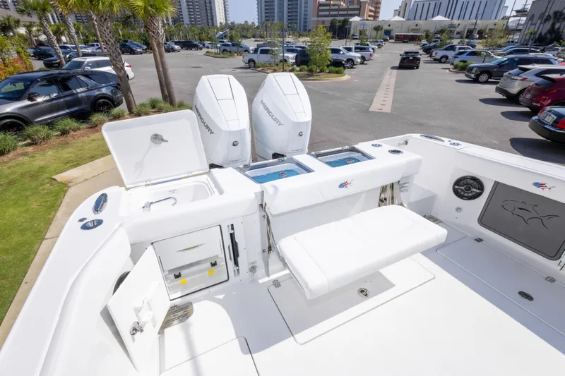 Slide: The Image of 2026 Crevalle 33 CSF boat with dual Mercury engines in a parking lot setting. - 35