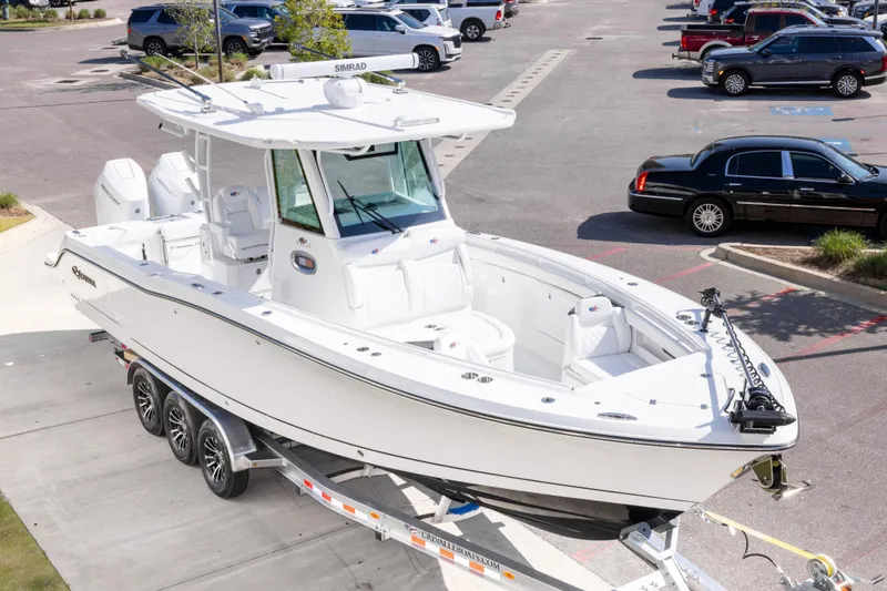 Slide: The Image of 2026 Crevalle 33 CSF boat on trailer in parking lot. - 4