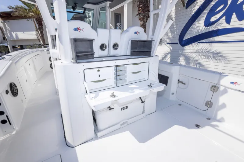 Slide: The Image of 2026 Crevalle 33 CSF boat interior with storage compartments and fishing equipment. - 41