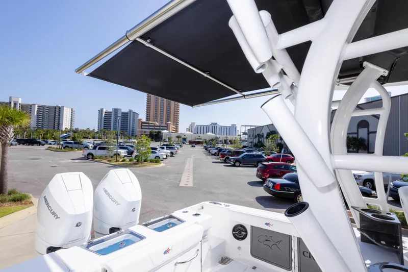 Slide: The Image of 2026 Crevalle 33 CSF boat with Mercury engines in a parking lot. - 42