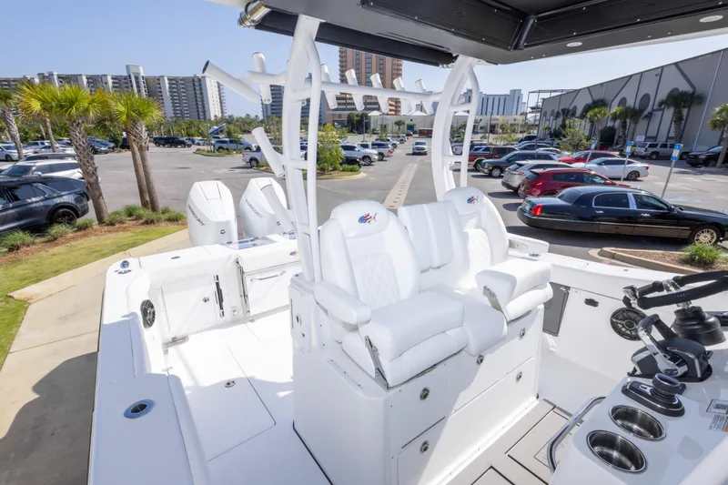 Slide: The Image of 2026 Crevalle 33 CSF boat interior with white seating and modern controls. - 44