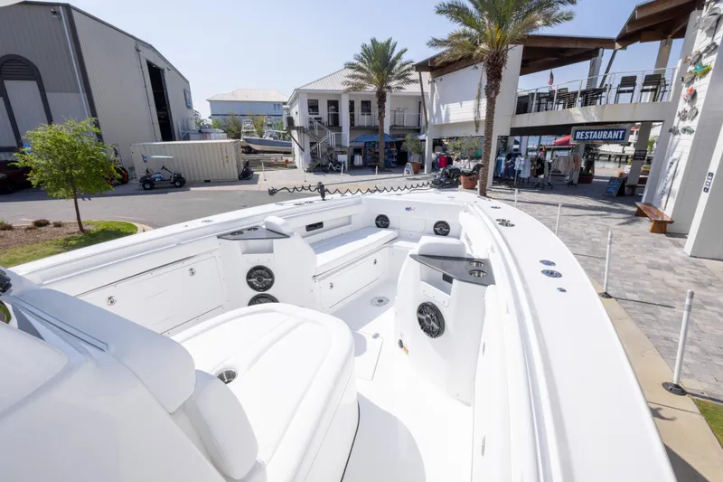 Slide: The Image of 2026 Crevalle 33 CSF boat docked near a restaurant and marina. - 50