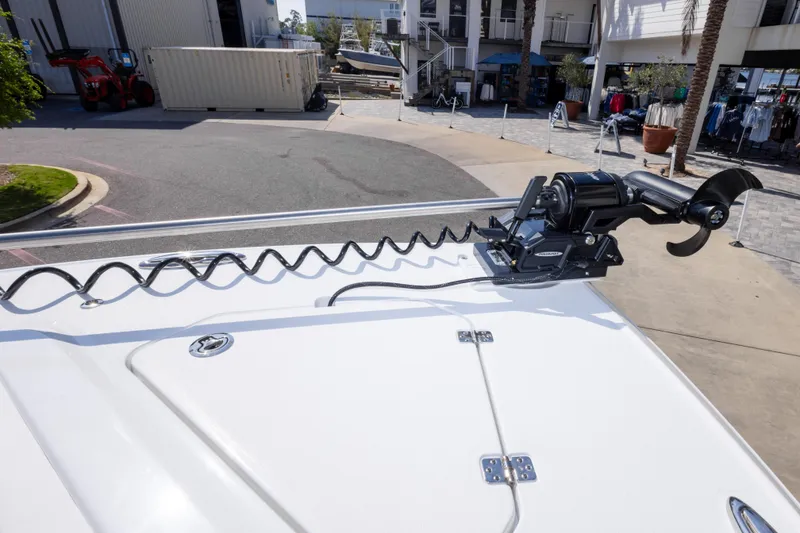 Slide: The Image of 2026 Crevalle 33 CSF boat deck with mounted trolling motor in marina setting. - 61