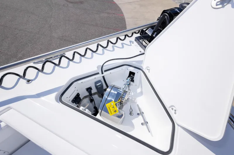 Slide: The Image of Open anchor compartment on 2026 Crevalle 33 CSF boat, showcasing storage and equipment. - 62