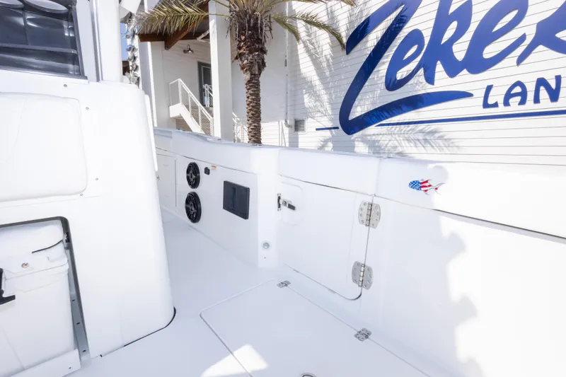 Slide: The Image of 2026 Crevalle 33 CSF boat interior with speakers and storage compartments. - 65