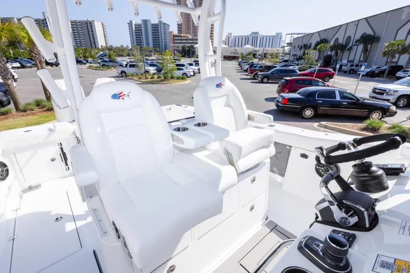 Slide: The Image of 2026 Crevalle 33 CSF boat interior with white seating and modern controls. - 67