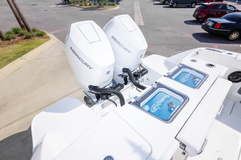 Slide: The Image of 2026 Crevalle 33 CSF boat with dual Mercury engines in a parking lot. - 68