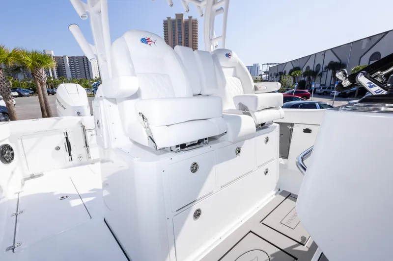 Slide: The Image of 2026 Crevalle 33 CSF boat interior with white seating and modern design. - 70