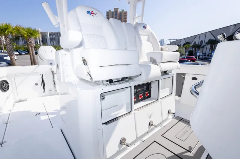 Slide: The Image of 2026 Crevalle 33 CSF boat interior with white seating and control panel. - 72