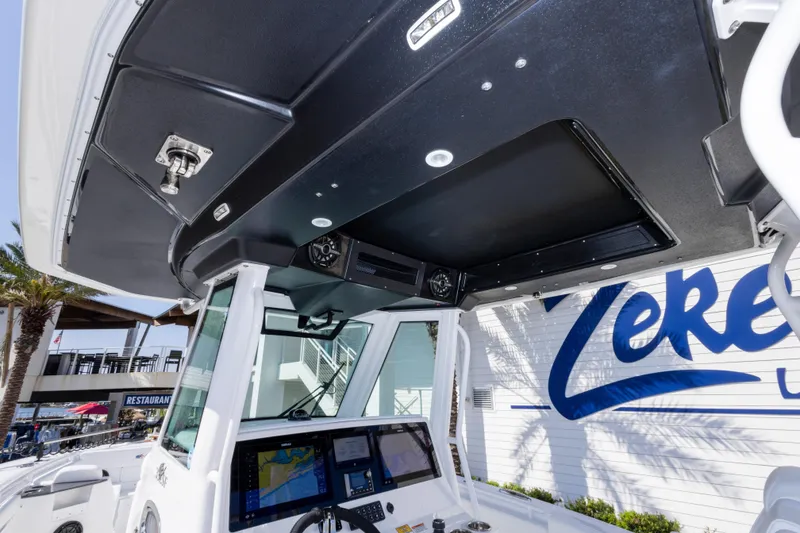 Slide: The Image of 2026 Crevalle 33 CSF boat helm with advanced navigation system and sleek design. - 74