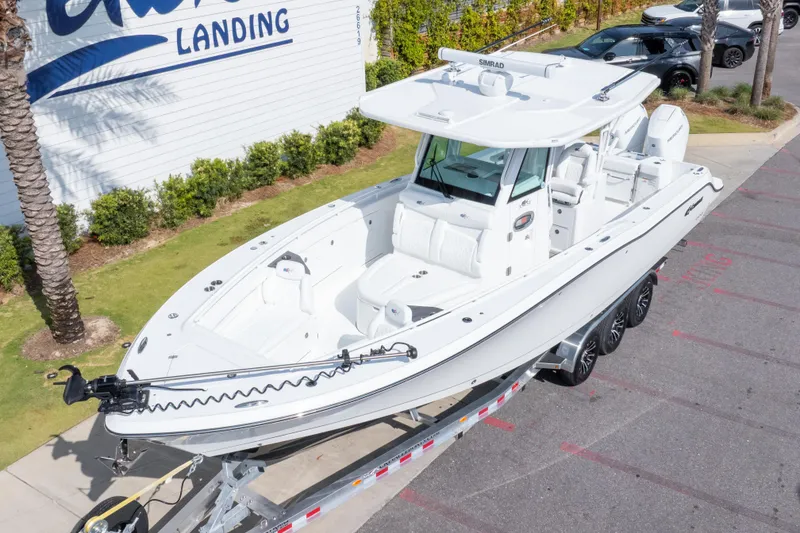 Slide: The Image of 2026 Crevalle 33 CSF boat on trailer at marina, side view. - 9