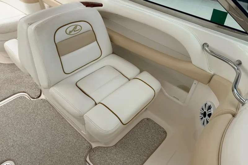 Slide: The Image of 2002 Sea Ray 290 Bowrider interior with beige and white seating. - 13